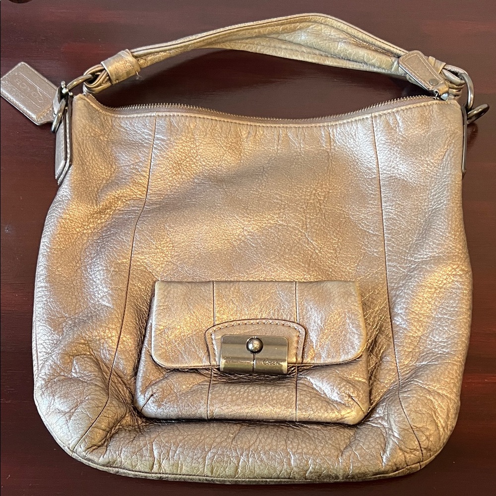 Metallic Gold coach bag quite luxury, sophisticated